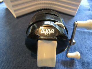 Vintage Zebco 202 spincast reel with box and papers 2