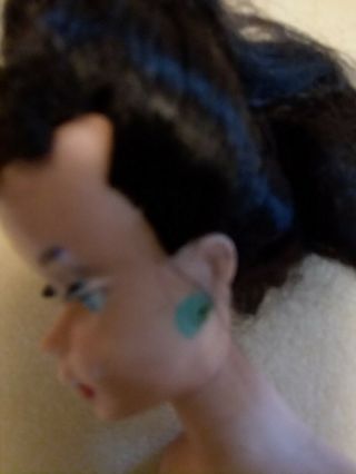 Vintage Barbie in black and white swim suit does have green ears 3