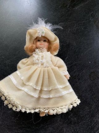 Miniature Porcelain Dolls In Vintage Dress And Matching Hat