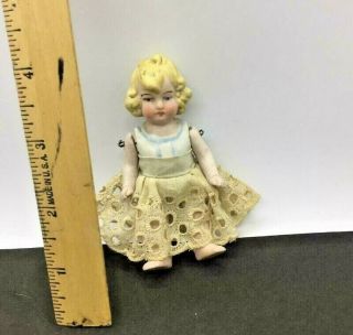 Antique All Bisque Doll.  Molded Blond Hair.  Wired Arms Legs.  Molded Undergarment