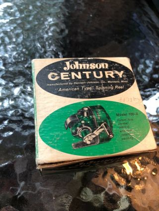 Johnson century 100 A fishing reel and display stand. 2