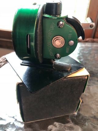 Johnson century 100 A fishing reel and display stand. 3