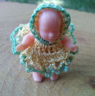 Vintage Tiny 1 And 1/8 " Plastic Baby Doll With Crochet Clothes.
