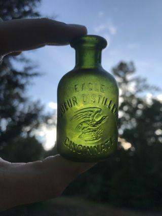 Antique Green Colored Eagle Distilleries / Cincinnati Ohio Sample Whiskey Bottle
