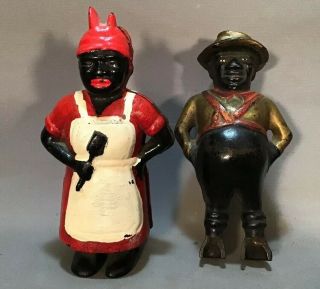 (2) Antique Black Americana Old Cast Iron Figural Ac Williams & Mammy Still Bank