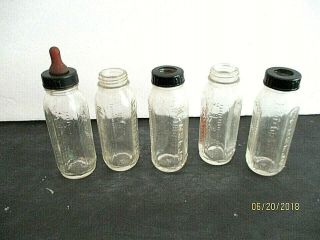 Vintage,  5 Glass Baby Bottles For Drink & Wet Dolls.  From Evenflo.  Some W/ Caps