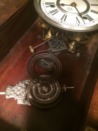 ansonia gingerbread clock with key,  pendulum and glass 7