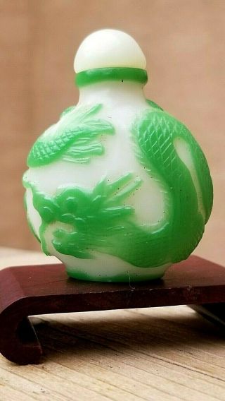 Antique Chinese Snuff Bottle Peking Glass Carved " Dragon " With White Jade Top