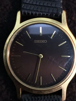 Vintage Seiko Quartz Mens Watch,  35mm Case Black Face Gold Dail