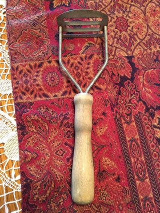 Antique Potato Masher,  Wooden Handle,  Slotted Metal Head,  Dated 7 - 3 - 1917,  Good.