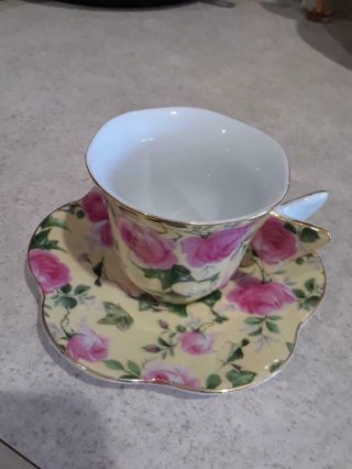 Pale Yellow Demitasse Cup And Saucer With Butterfly Handle