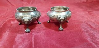 A Matching Victorian Silver Plated Salt Pots With Lions Faces.