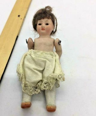 Antique Bisque Doll Wired Jointed Arms Legs.  Painted Face.  Eyes Inset.  3 - 1/2 "