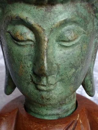 Beautifully serene early 20th C Chinese cast metal Buddha head on a wood plinth 7