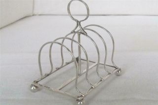 A Solid Sterling Silver Edwardian Shaped Five Bar Toast Rack Chester 1901