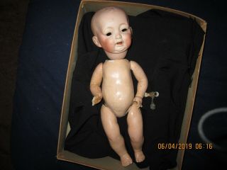 14 " Bisque Baby With Rocking Eyes