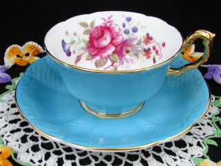 Paragon Rose Floral Spray Sky Blue Embossed Tea Cup And Saucer