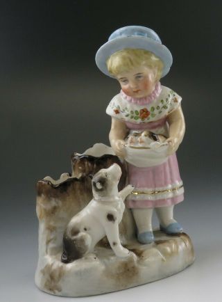 German Porcelain Match Holder Girl With Her Dog & An Apron Of Puppies Figure