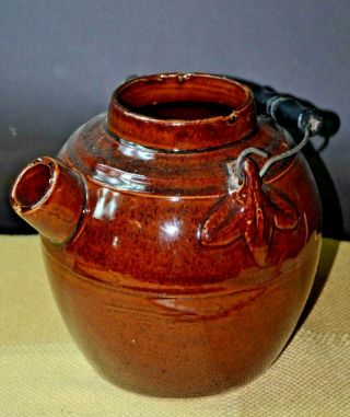 Antique Ceramic Reddish Brown Glazing And Primitive Handle Batter Jug.