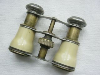 3 pairs of antique and vintage opera glasses. 7
