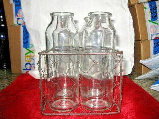 Four Collectible Vintage Antique Glass Baby Bottles In Metal Carrier