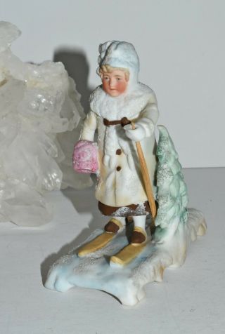 Antique German Bisque Porcelain Girl Skiing Through Forest Figure Figurine