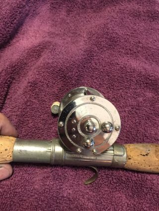 Vintage Quadruple reel on vintage rod base 3