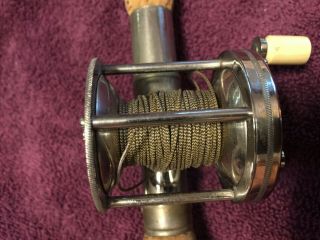 Vintage Quadruple reel on vintage rod base 5