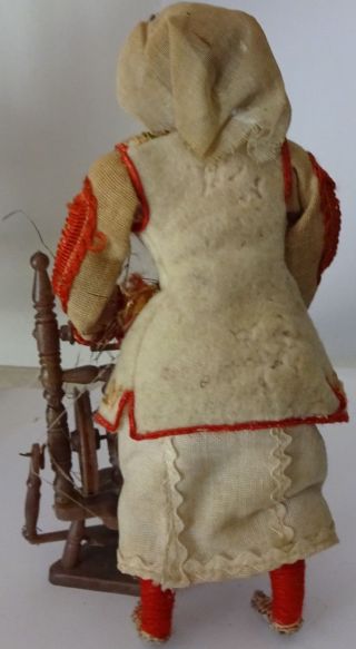 Vintage doll in Serbian folk costume with spinning wheel.  1950. 2
