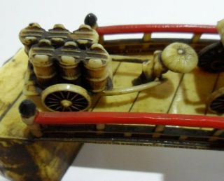 Antique/vintage Japanese celluloid bridge with a variety of different figures. 5