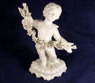 Antique Continental Blanc De Chine Cupid Cherub With Rose Garland Figurine