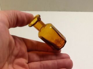 Small Antique Embossed Norgine 8 Sided Ink Bottle With Pour Spout.