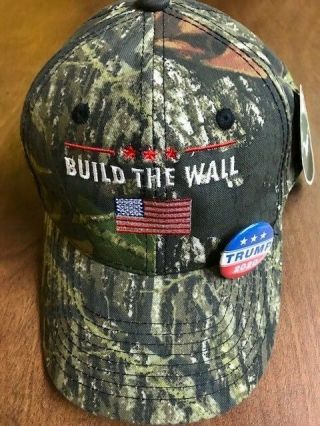 Build The Wall Mossy Oak Break - Up Maga Cap Flag With Trump 2020 Pin
