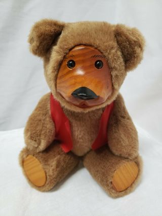 Vintage Brown Jointed Teddy Bear With A Wooden Face And Paws Wearing A Red Vest,