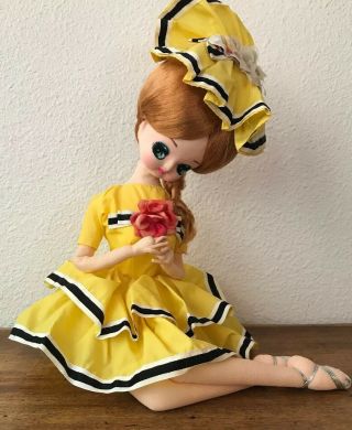 Vintage Big Eyed Doll Bradley Sitting With Yellow Black Dress