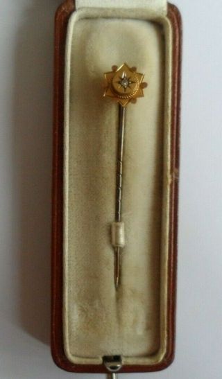 Antique 9ct gold and diamond stick pin in a box and clearly marked ' 9ct '. 2