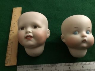 1 Antique Simon & Halbig,  1 Antique A.  O.  M Doll Heads One Smiling,  One Pouting