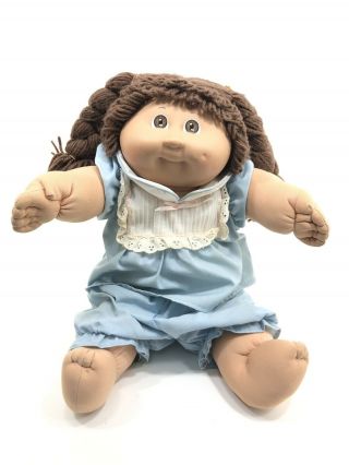 Vintage 1982 Cabbage Patch Doll 16” Brown Haired Wearing Tagged Blue Dress