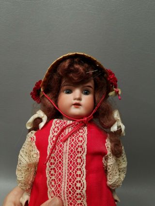 Vintage bisque doll marked Germany leather body 15 