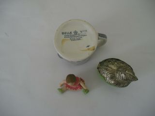 three antique items willow milk jug a metal chicken box a porcelain mini doll 8