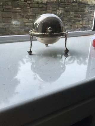 A Antique Silver Plated Roll Top Butter Dish With Engraved Patterns.