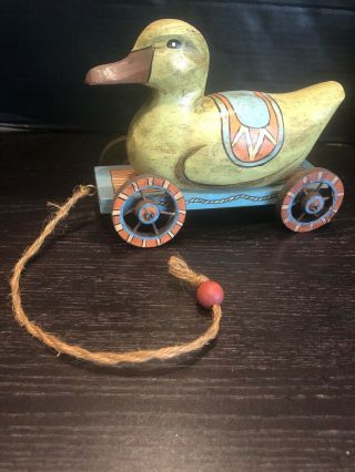 Vintage Hand Carved And Painted Wooden Duck Folk Art Pull Toy On Wheeled Cart.