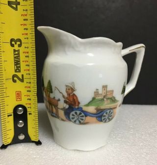 Antique Porcelain Child ' s Toy Pitcher Creamer Boy wooden horses cannon GERMANY 2
