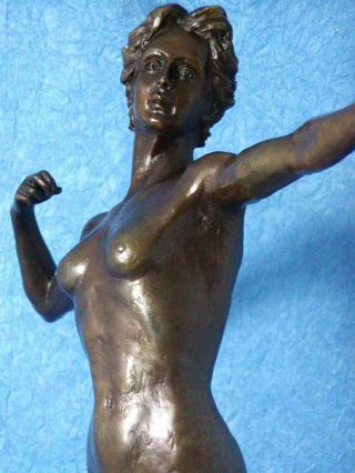 Diana with a bow statue made of bronze standing on a marble base 4