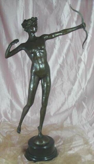 Diana with a bow statue made of bronze standing on a marble base 7
