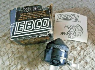 Vintage Black & White Zebco 202 Spincast Fishing Reel & Papers Usa