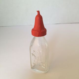 Vintage Clear Glass Doll Baby Bottle.  Embossed Dog On The Front Red Nipple
