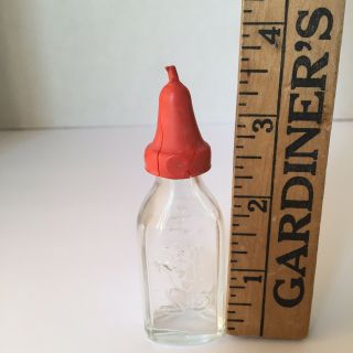 Vintage Clear Glass Doll Baby Bottle.  Embossed Dog on the Front Red Nipple 2