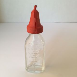Vintage Clear Glass Doll Baby Bottle.  Embossed Dog on the Front Red Nipple 4