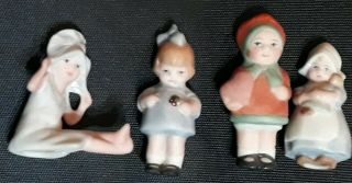 Set Of 4 Vintage Miniature 1” - 1 1/2 " Child Girl Dutch Bisque Dolls Hand Painted